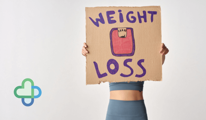 woman on wegovy holding up weight loss sign - buy cheap wegovy online - the family chemist