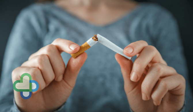 woman who has quit smoking with the help of zyban snapping cigarette in half | Buy zyban online