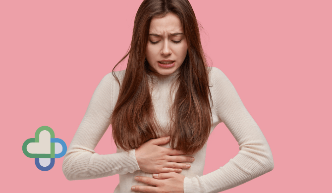 woman with period pain clenching her stomach - buy period pain tablets