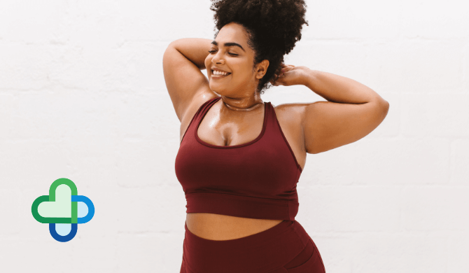 obese woman in sports bra on mounjaro smiling