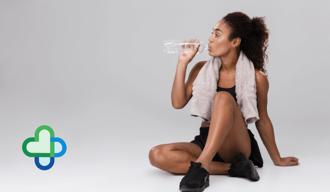 woman drinking water to boost her metabolism - weight loss - the family chemist